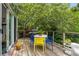 Outdoor deck with dining area and lush greenery at 1601 Marlbrook Ne Dr, Atlanta, GA 30307