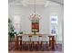 Elegant dining room with modern chandelier, a large wooden table, and stylish decor at 1601 Marlbrook Ne Dr, Atlanta, GA 30307