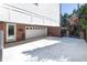 Expansive driveway with a basketball hoop leading to a multi-car garage and gated access at 1601 Marlbrook Ne Dr, Atlanta, GA 30307