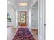 Bright foyer with hardwood floors, a decorative rug, and a view through the front door at 1601 Marlbrook Ne Dr, Atlanta, GA 30307