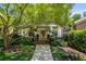 Charming home entrance featuring a covered porch, meticulous landscaping, and a welcoming walkway at 1601 Marlbrook Ne Dr, Atlanta, GA 30307