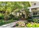 Charming home entrance featuring a covered porch, meticulous landscaping, and a welcoming walkway at 1601 Marlbrook Ne Dr, Atlanta, GA 30307