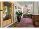 Inviting front porch with brick flooring, a ceiling fan, and a view of the landscaped front yard at 1601 Marlbrook Ne Dr, Atlanta, GA 30307