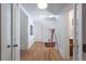 Well-lit hallway with hardwood floors, white walls, and contemporary design at 1601 Marlbrook Ne Dr, Atlanta, GA 30307