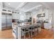 Modern kitchen features stainless steel appliances, eat-in island, hardwood floors and white cabinets at 1601 Marlbrook Ne Dr, Atlanta, GA 30307