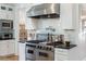 A kitchen features stainless steel appliances, custom cabinets, and granite countertops at 1601 Marlbrook Ne Dr, Atlanta, GA 30307