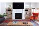 Modern living room featuring a fireplace, built-in shelves, and stylish furniture at 1601 Marlbrook Ne Dr, Atlanta, GA 30307