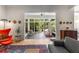 Open-concept living room with hardwood floors and a view of the deck through large windows at 1601 Marlbrook Ne Dr, Atlanta, GA 30307