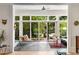 Bright and airy living room with floor to ceiling windows and door leading to a patio overlooking a lush yard at 1601 Marlbrook Ne Dr, Atlanta, GA 30307