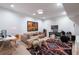 Comfortable living room featuring a plush couch, area rug, and musical instruments at 1601 Marlbrook Ne Dr, Atlanta, GA 30307