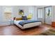 Comfortable main bedroom features hardwood floors, a large bed, and natural light at 1601 Marlbrook Ne Dr, Atlanta, GA 30307
