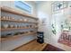 Walk-in pantry boasts open shelves for storage at 1601 Marlbrook Ne Dr, Atlanta, GA 30307