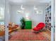Comfortable sitting room featuring wood floors, bright colors, unique furniture, a large bookcase, and lots of light at 1601 Marlbrook Ne Dr, Atlanta, GA 30307