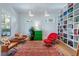 Comfortable sitting room featuring wood floors, bright colors, unique furniture, a large bookcase, and lots of light at 1601 Marlbrook Ne Dr, Atlanta, GA 30307