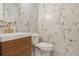 Bathroom featuring marble tile, modern fixtures, and minimalist design at 535 Emerald Pkwy, Sugar Hill, GA 30518