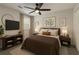 Inviting bedroom with warm tones, stylish furniture, and a large window at 535 Emerald Pkwy, Sugar Hill, GA 30518