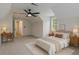 Comfortable bedroom featuring vaulted ceilings and stylish, neutral decor at 535 Emerald Pkwy, Sugar Hill, GA 30518