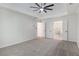 Expansive bedroom featuring an open double doorway to another bathroom at 535 Emerald Pkwy, Sugar Hill, GA 30518