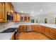 Kitchen area with stainless steel appliances and light wood cabinetry at 535 Emerald Pkwy, Sugar Hill, GA 30518