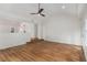 Open-concept living room with vaulted ceilings, luxury vinyl flooring, and natural light at 535 Emerald Pkwy, Sugar Hill, GA 30518