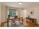 Cozy home office featuring a sleek desk, comfortable chair, and ample natural light at 535 Emerald Pkwy, Sugar Hill, GA 30518