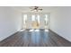 A spacious living room offers plenty of natural light and gorgeous hardwood flooring at 105 Iveybrooke Ln # 57, Alpharetta, GA 30009