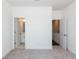 A view of the large main bedroom featuring ensuite bathroom, and access to the upper level at 105 Iveybrooke Ln # 57, Alpharetta, GA 30009