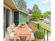 Relaxing outdoor balcony with comfortable seating and a view of the surrounding greenery at 1206 Canyon Point Cir, Roswell, GA 30076