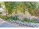 Stone community entrance sign with manicured landscaping and mature trees at 1206 Canyon Point Cir, Roswell, GA 30076