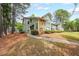 Charming condo complex featuring well-maintained landscaping, stone accents, and lush greenery at 1206 Canyon Point Cir, Roswell, GA 30076