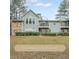 Charming exterior view of the home with an attached stone facade and a balcony with sliding glass doors at 1206 Canyon Point Cir, Roswell, GA 30076