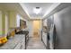 Modern kitchen with stainless steel appliances, granite countertops, white cabinets, and ample storage at 1206 Canyon Point Cir, Roswell, GA 30076