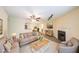 Comfortable living room featuring neutral tones, a ceiling fan, and a cozy fireplace at 1206 Canyon Point Cir, Roswell, GA 30076