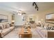 Inviting living room featuring comfortable furniture, an open floor plan and modern lighting at 1206 Canyon Point Cir, Roswell, GA 30076