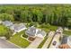Aerial view of a home with mature trees, a spacious yard, and two driveways at 1320 Pinyon Pl, Lawrenceville, GA 30043