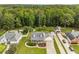 Aerial view of a charming neighborhood with mature trees surrounding well-maintained homes at 1320 Pinyon Pl, Lawrenceville, GA 30043