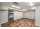 Bright basement with durable floors and a peek into the convenient kitchenette at 1320 Pinyon Pl, Lawrenceville, GA 30043