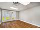 Finished basement room with wood floors and doors leading to the outdoors at 1320 Pinyon Pl, Lawrenceville, GA 30043