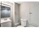 Small bathroom with a single sink, toilet, and stand up shower providing the basic amenities at 1320 Pinyon Pl, Lawrenceville, GA 30043