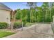 Long driveway with a backyard fence provides ample parking and privacy at 1320 Pinyon Pl, Lawrenceville, GA 30043