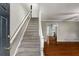 Spacious entryway showcasing hardwood floors and staircase leading to the upper level at 1320 Pinyon Pl, Lawrenceville, GA 30043