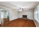 Inviting living room with hardwood floors, fireplace, and natural light at 1320 Pinyon Pl, Lawrenceville, GA 30043
