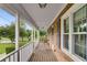 Inviting porch view highlighting brick accents, white columns, and ample space for relaxing outdoors at 1320 Pinyon Pl, Lawrenceville, GA 30043