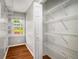 Walk-in closet with shelving and hardwood floors at 1320 Pinyon Pl, Lawrenceville, GA 30043