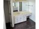 Bathroom featuring a vanity with bright lighting and a large mirror at 240 Flowers Cove Ln, Lilburn, GA 30047