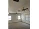 Spacious bedroom with two ceiling fans and windows at 240 Flowers Cove Ln, Lilburn, GA 30047