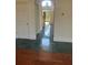 A front entryway with natural light and a hardwood floor at 240 Flowers Cove Ln, Lilburn, GA 30047