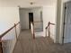 Hallway featuring access to a loft area and surrounding rooms at 240 Flowers Cove Ln, Lilburn, GA 30047