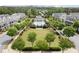 Aerial view of community with a pool, clubhouse, and manicured green spaces at 1074 Heyward Way, Alpharetta, GA 30009
