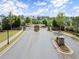Grand entrance to the community with brick pillars, secure gates, and landscaped surroundings at 1074 Heyward Way, Alpharetta, GA 30009